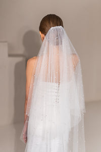 Close-up of pearl and sparkle detail on wedding veil