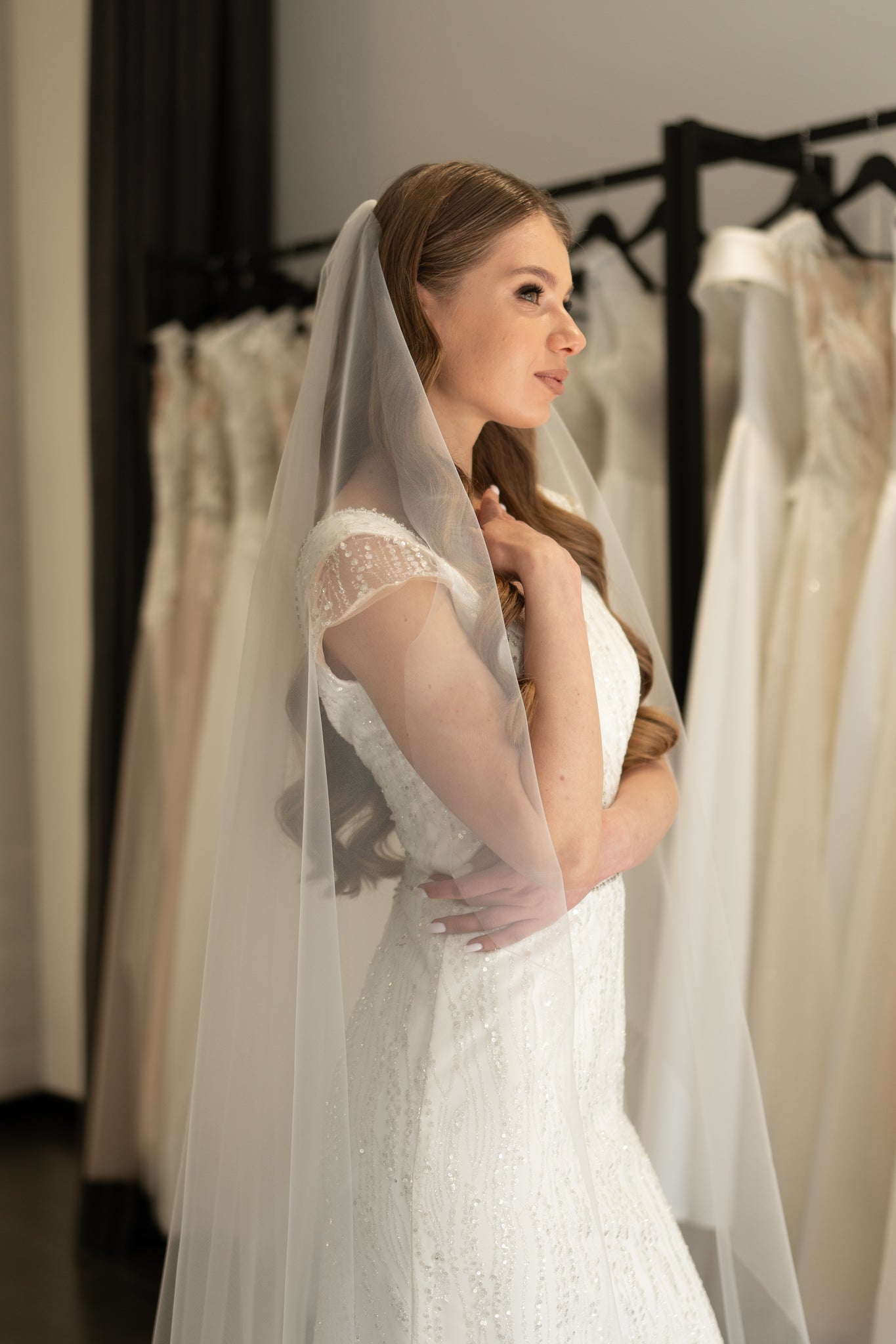 Lightweight ivory wedding veil with metal comb attachment
