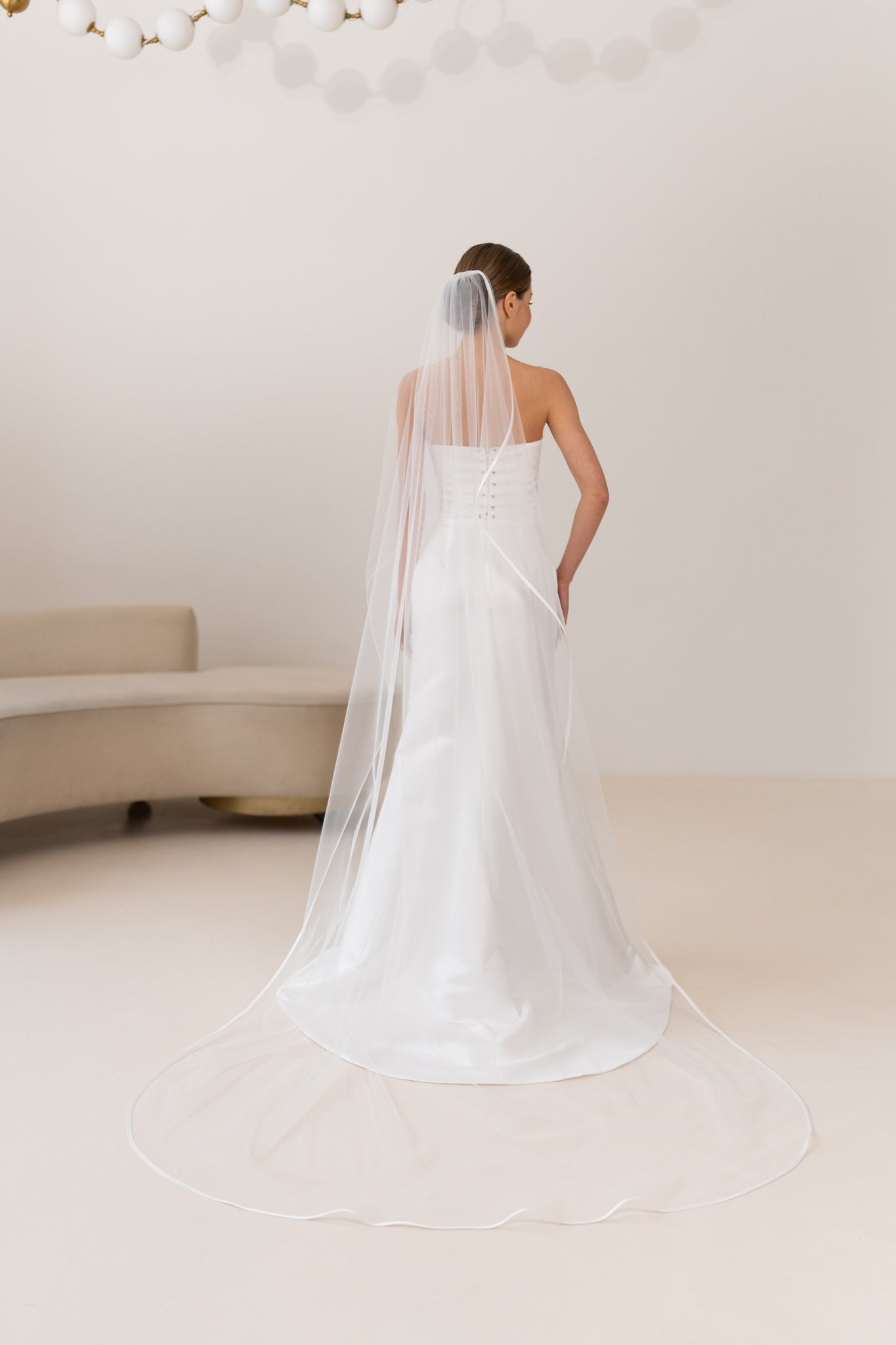 Satin ribbon bridal veil secured with metal comb