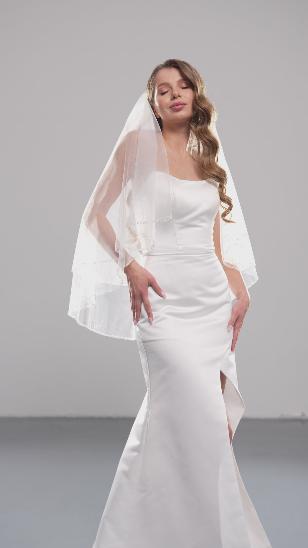 Pearl beaded wedding veil with blusher