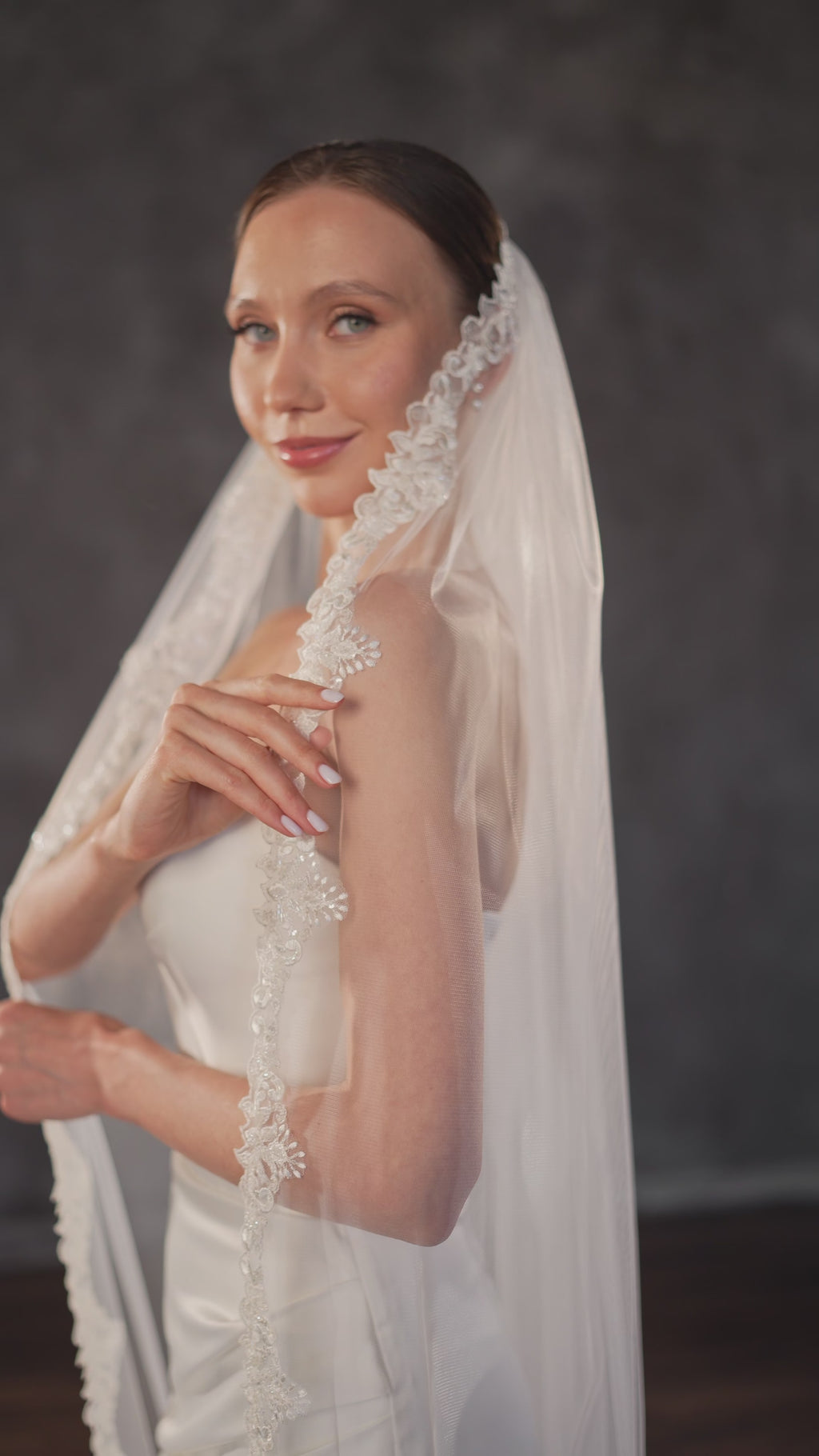 Floral lace wedding veil with sparkling embroidered edge.