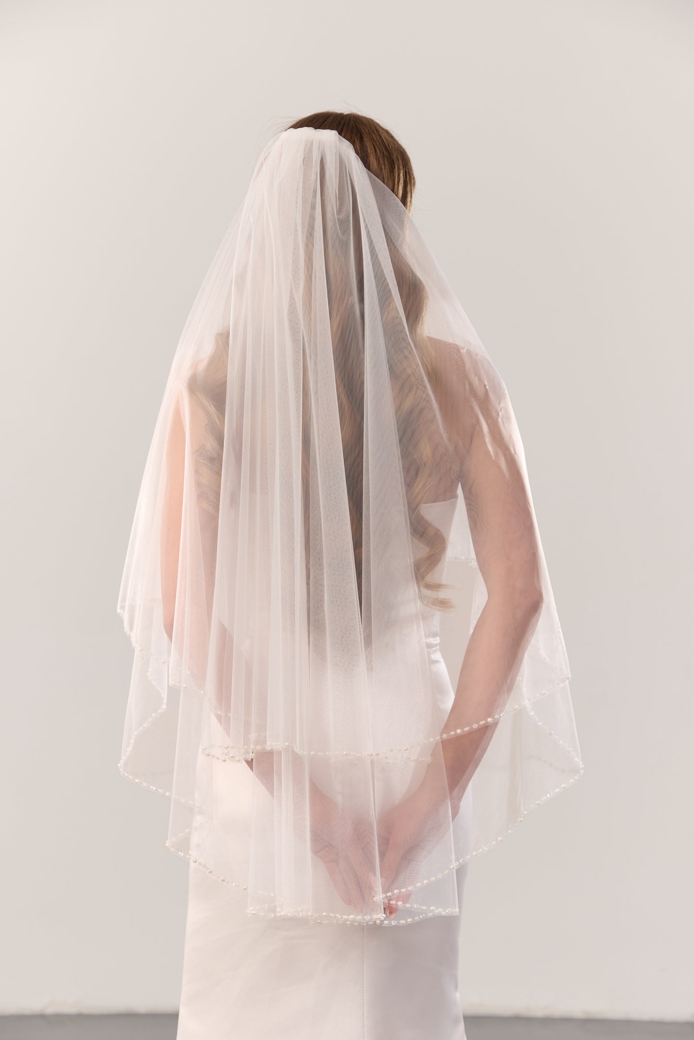 Pearl beaded wedding veil with blusher